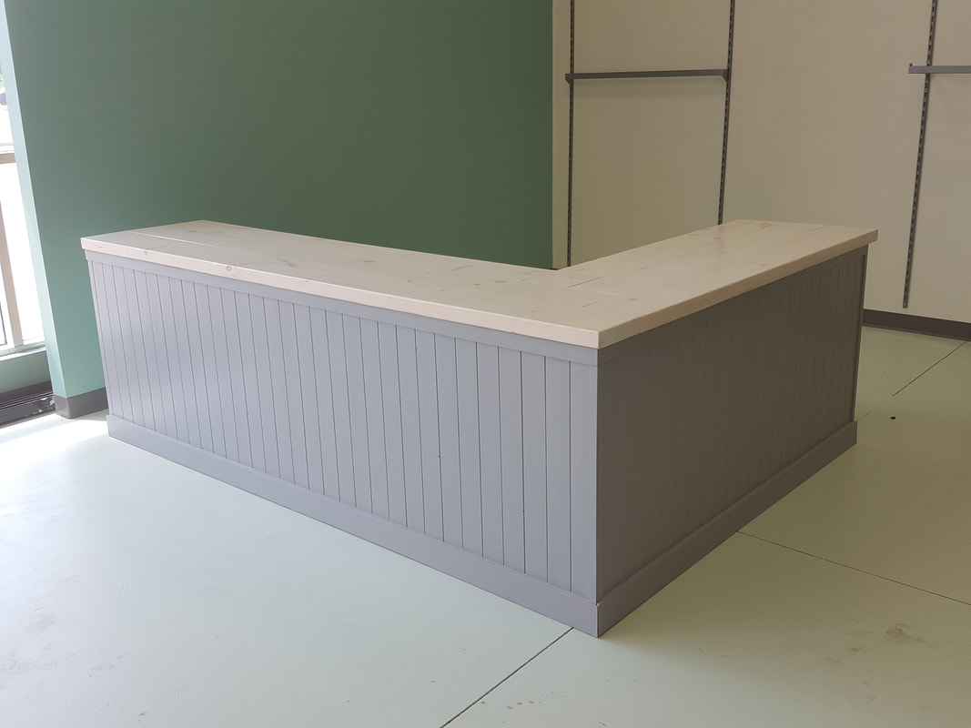 Custom retail reception counters and store displays in Kitchener Waterloo Cambridge, Guelph and GTA, Custom Store Fixtures in Kitchener Waterloo Cambridge, Guelph and Toronto, retail millwork, custom millwork, custom cabinets, Kitchener restaurant furniture