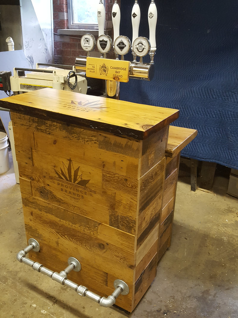 Custom home and commercial bars and bar tops and promotional booth displays in Kitchener Waterloo, Cambridge, Guelph and Toronto, reclaimed wood bar, custom bar stools, custom bar top, reclaimed wood bar top, rustic bar, custom bar, epoxy bar top